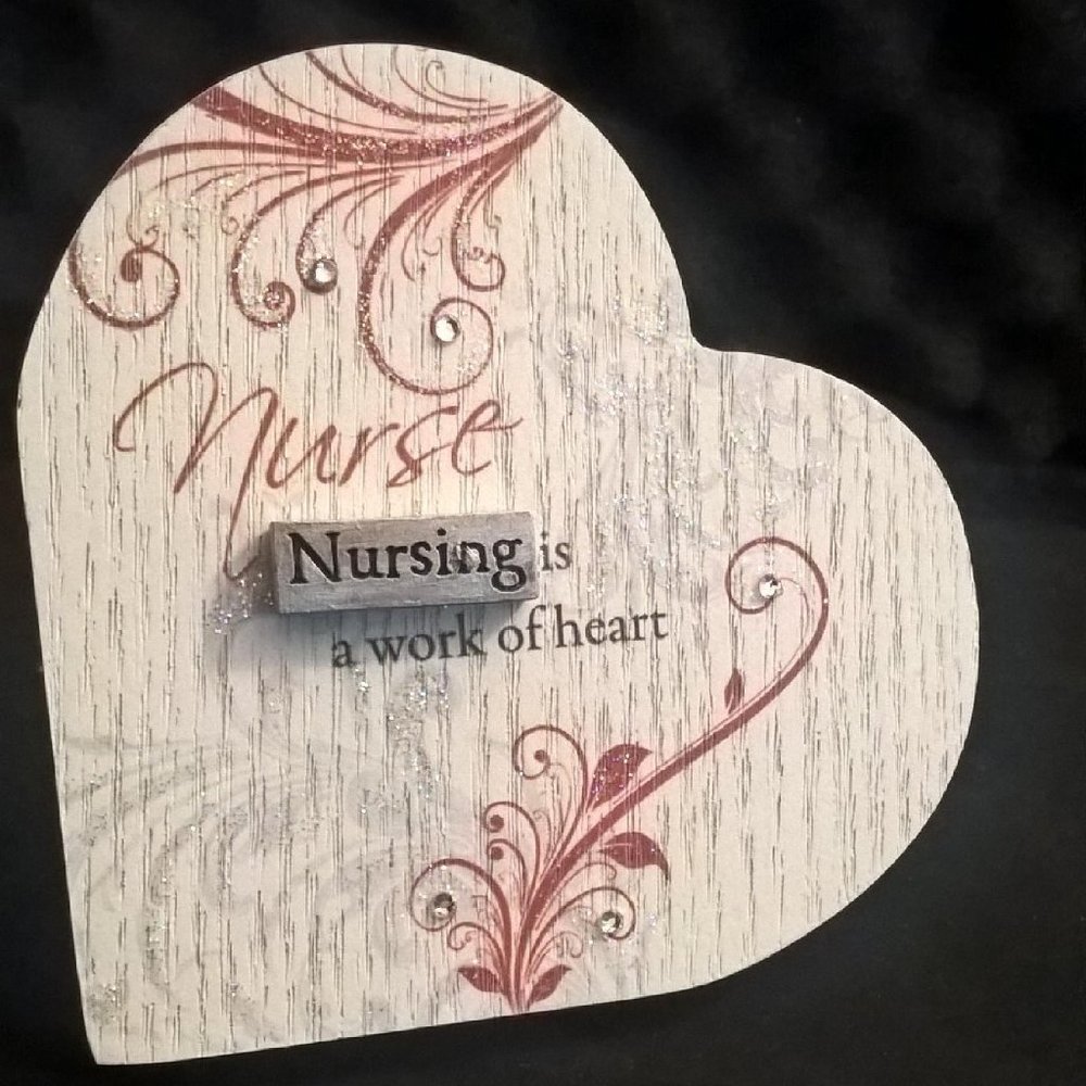 Charming Plaque NURSING IS A WORK OF HEART ( Heart Shaped )